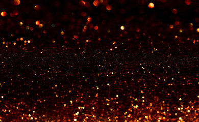 Fototapeta na wymiar gold glitter Christmas lights abstract background. de-focused.