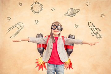 Kid with jet pack at home