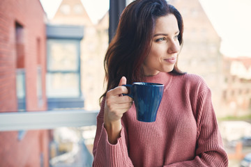 Positive woman with a cup of coffee. Time for break - 175970763
