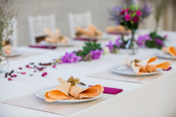 Table with the glasses and plates for party
