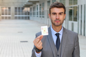 Poker player showing a card