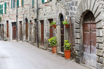 Back street with house doors in an old town