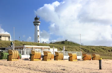 Foto auf Acrylglas Lighthouse and beach in Egmond aan Zee. North Sea, the Netherlands. © eugen_z
