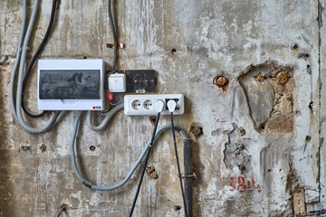 Old wall with electrical outlets