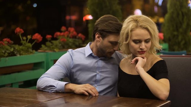 Young woman in bad mood reluctant to talk to boyfriend, upset and jealous