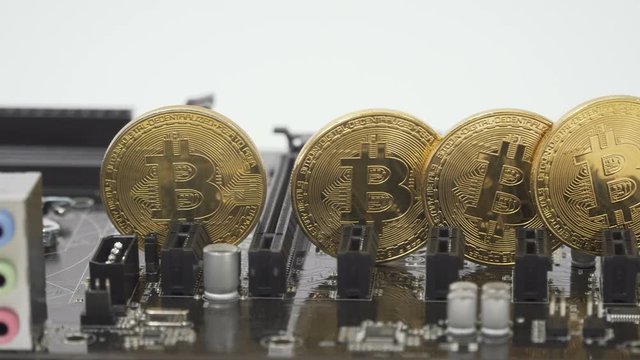 Golden bitcoins on the motherboard
