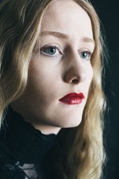 Teen girl with blonde hair and red lipstick