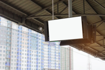 CCTV and LCD TV with white blank screen or billboard, copy space for advertising or media and content with blurred view of condominium or office building, commercial, marketing and advertising concept
