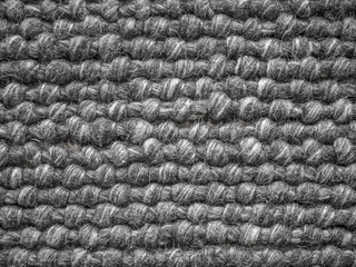 Close up of a wool carpet. Black and White texture. Modern design.