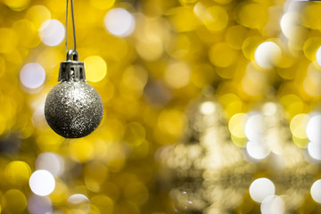 Christmas decoration on a golden background. bokeh background and dark mirror floor.
