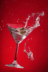 Cocktail Splashes Serie in 5 different colors with an Olive making different shapes in the martini: Red