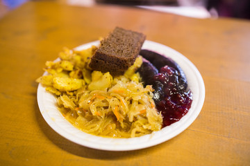 braised cabbage and sausages with sauce on plate