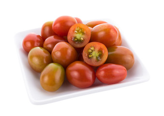 tomato in white plate on white background