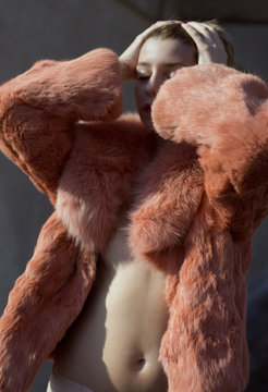 woman in orange fur coat