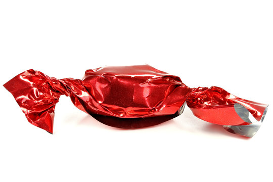 candy in red wrapper isolated on white background