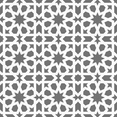 Islamic seamless vector pattern. White Geometric ornaments based on traditional arabic art. Oriental muslim mosaic. Turkish, Arabian, Moroccan design on a dark background. Mosque decoration element
