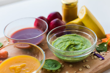 vegetable puree or baby food in glass bowls