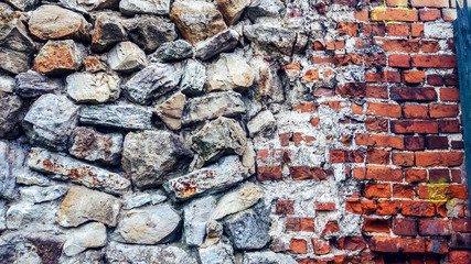 Stone old wall from huge blocks. Background of stones. The concept of reliability. Beautiful textured vintage antique background.