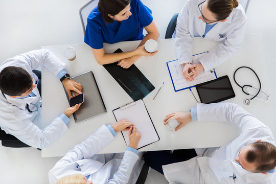 Group Of Doctors Having Coffee Break At Hospital