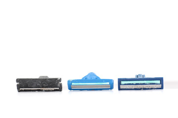 used shaving razor on a white brown background