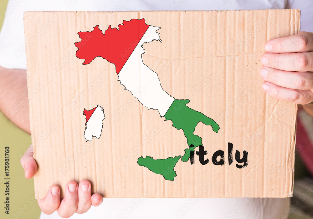 Wall mural italian map on cardboard in hands man