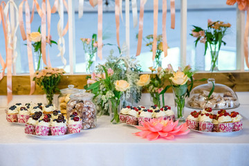 candy bar on wedding banquet with flowers