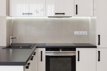 New modern kitchen with built in oven and chrome water tap