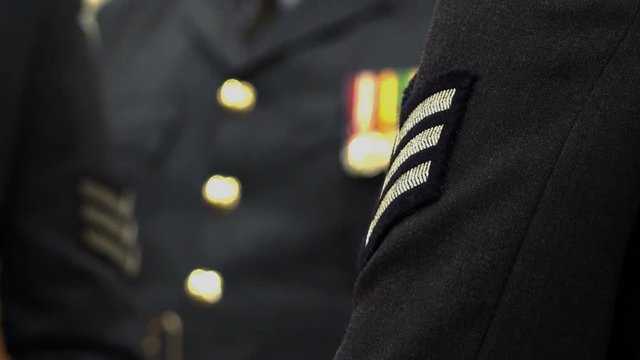 The blue uniform of the Royal Air Force showing medals and stripes.