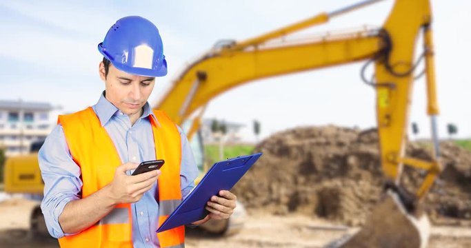 Worker talking on the phone in a construction site