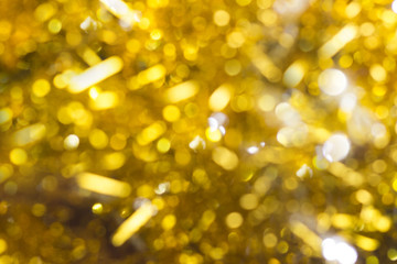 Christmas decoration on a golden background. bokeh background and dark mirror floor.
