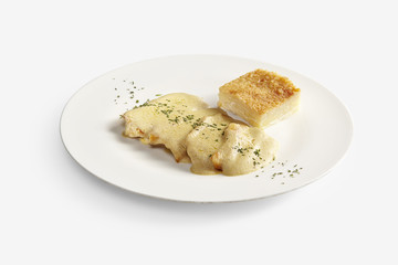 Chicken cutlets with foie gras sauce and potatoes cake on white background