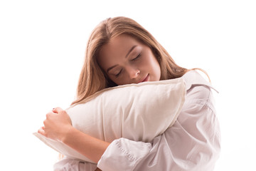 Blond girl, woman sit on floor hugs pillow and sleep and smile
