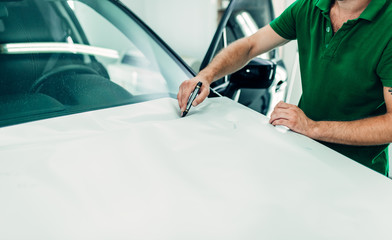 Mechanic prepares car protect coating