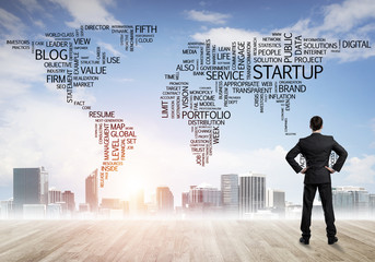 Motivation and inspiration concept with modern cityscape and businessman observing it