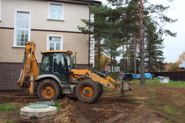 Tractor JCB is working.
