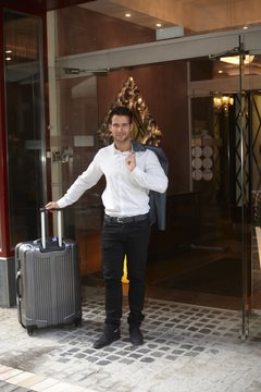 Businessman leaving hotel