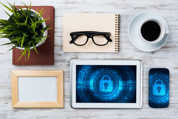 Web security and technology concept with tablet pc on wooden table