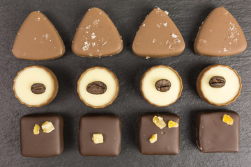 differently decorated white and brown chocolate pralines