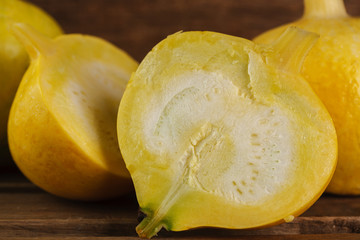 yellow pumpkins on wooden background