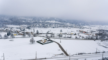 Fototapeta na wymiar Aerial view of snow covered town.