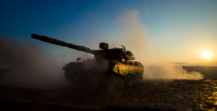 War Concept. Military silhouettes fighting scene on war fog sky background, World War Soldiers Silhouettes Below Cloudy Skyline at sunset. Armored vehicles. German tank in action