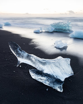 Blocks of ice on a black sand beach