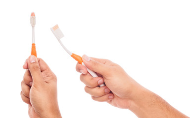 male hand holding toothbrush