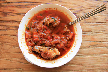 Chakhokhbili - traditional Georgian dish. Chicken stewed with tomatoes