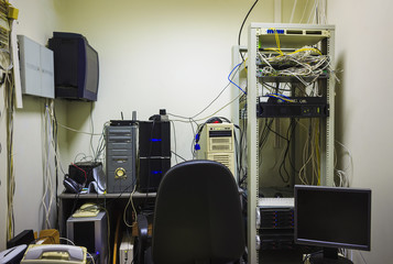 The empty workplace of the system administrator. The programmer develops software.