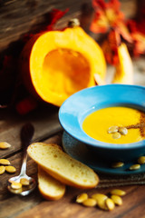 Pumpkin soup served in a hollowed pumpkins