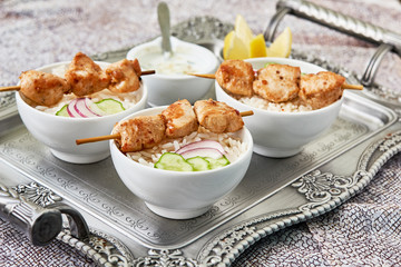 Chicken skewers and rice on a tray. Healthy diet food concept