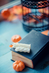 Halloween - Lanterns And Pumpkins On Wooden Table In A Haunted Forest