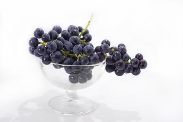 Raw dark grapes isolated on white background.