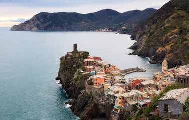 Vernazza from above, with the castle and rocky cliff overlooking the sea.